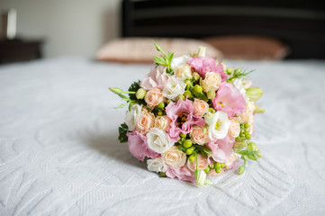 soft photo romantic bouquet of roses flower on the bed, window blurred background.