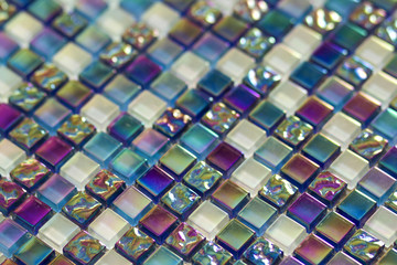 Geometric blue, purple and green mosaic tiles pattern. Wallpaper texture background. Small pieces...