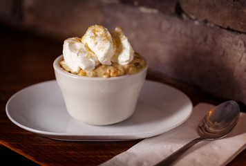 Single Serving of Banana Pudding in Rustic Setting