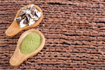 Seeds and moringa powder on the wooden background - Moringa oleifera
