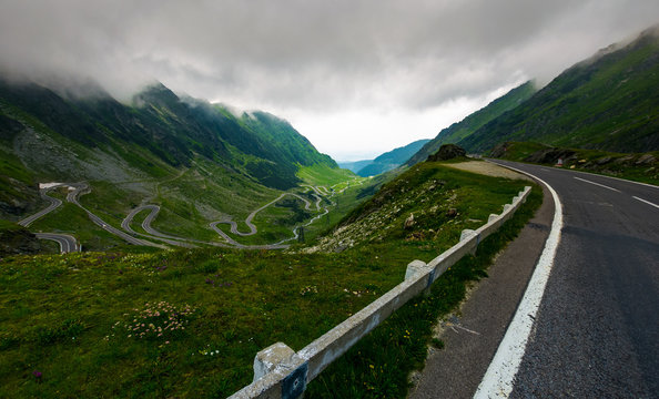 Transfagarasan road in stormy weather. dangerous driving concept. view from the side of the road
