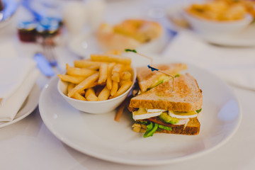 chicken sandwiches with chips and side dish bokeh