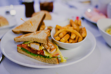 chicken sandwiches with chips and side dish bokeh