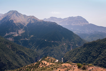 Fototapeta na wymiar Panoramic view of mountain in National Park of Tzoumerka, Greece Epirus region. Mountain in the clouds