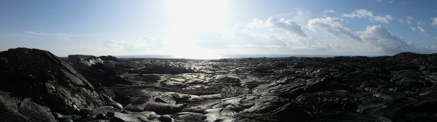 Lava field Hawaii black rock barren wasteland panoramic - Powered by Adobe
