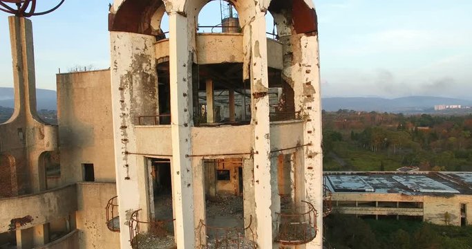 Destroyed the post-war building of the former sports resort in Lower Esher Abkhazia on the background of nature.