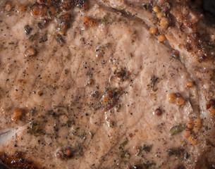 grilled beef steak with rosemary, frying pan