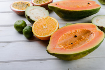 tropical exotic  fruits papaya,  guava, orange, passion on white background