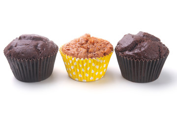 Assorted with Delicious homemade cupcakes with raisins and chocolate isolated on white background. Muffins. Top view.