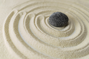 Fototapeta na wymiar Zen stone garden on white sand