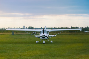 old airplane on a field ready to take off