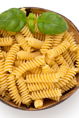 Uncooked fusilli pasta isolated white background.