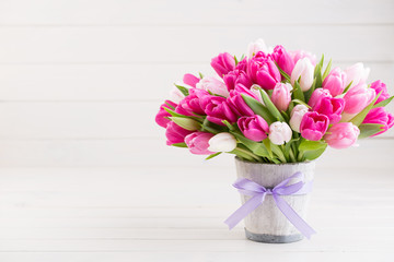 Pink tulip on the white background. Easter background