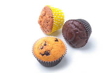 Assorted with Delicious homemade cupcakes with raisins and chocolate isolated on white background. Muffins. Top view.