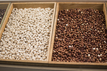 Peanuts in a wooden crate. Peanuts are a valuable oil crop. 47 to 54% of high-quality fats, proteins (20-37%) and carbohydrates accumulate in the seeds.