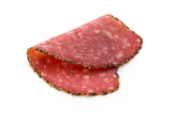 Salami slices isolated on the white background.