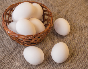 Fresh organic eggs in a basket. Natural healthy food concept.