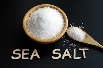sea salt in wooden bowl and spoon