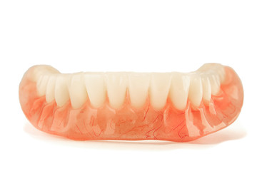 Close-up of plastic denture teeth isolate no fond background. New technologies in modern dentists.