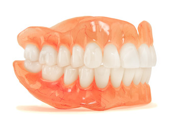 Close-up of plastic denture teeth isolate no fond background. New technologies in modern dentists.