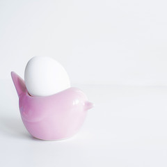 White Egg in Pink Bird Shape Stand