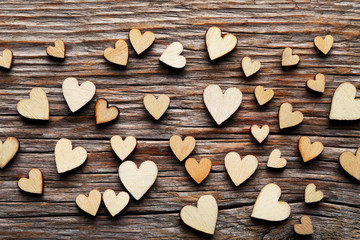 Brown wooden hearts on grey table