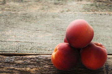 Sweet nectarines fruit on wooden table
