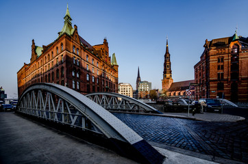 Hamburg storage city in the morning with St. Catherine's Church and St. Nicola after rain showers