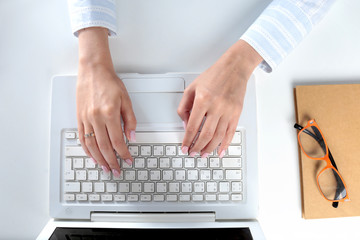 Fototapeta na wymiar Female office worker typing on the keyboard
