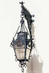 Vintage lantern close-up on buildings facade