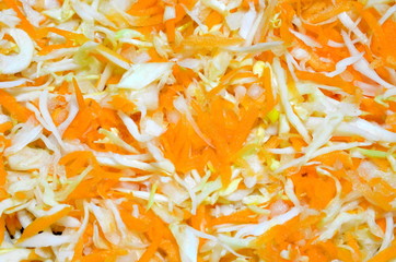 
Vegetable slicing of juicy cabbage and carrots.