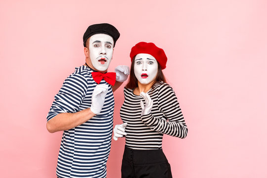 Portrait of very scared young adult couple