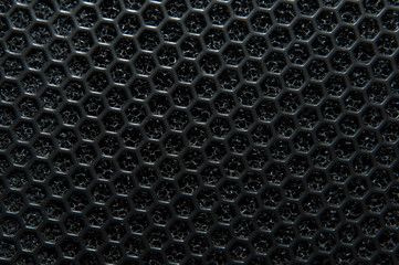 Abstract black macro texture of a musical column. Close up background