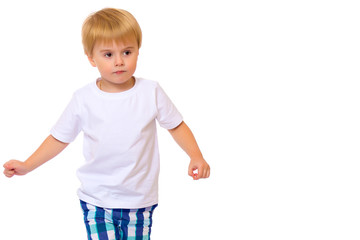 A little boy in a white T-shirt.