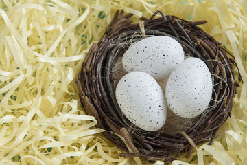 Naklejka na ściany i meble three bird eggs lie in the nest