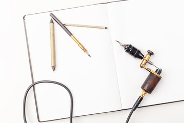 Tools of tattoo artist. Subjects for tattooing. Tattoo studio