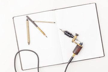 Tools of tattoo artist. Subjects for tattooing. Tattoo studio