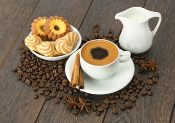 A Cup of coffee with fresh cookies .