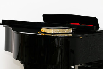 The Bible on the Black Piano
