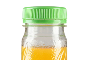closed bottle with orange juice