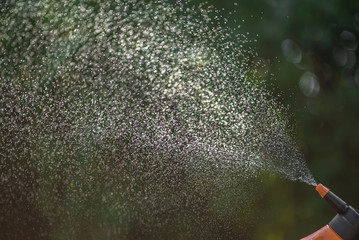 Water droplets spray close up with bokeh