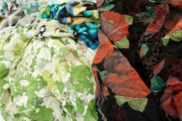 green crinkled textile with leaf motive and red flower for background wallpaper spring