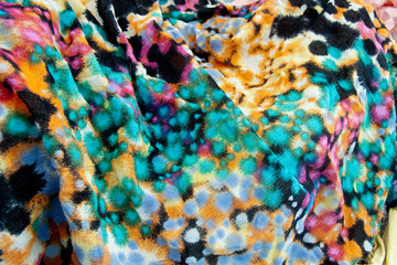 very colorful textile background with red, blue yellow black spots