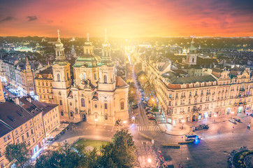 Fototapeta premium Panoramic view to St. Nicholas Church at old town square with beautiful sunset in the Prague