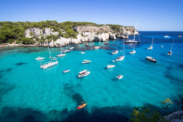 Obraz premium Boats and yachts on Macarella beach, Menorca, Spain