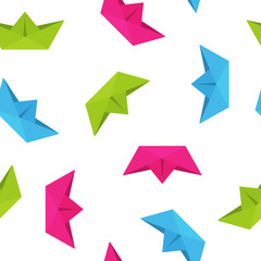Fototapeta premium Colorful origami paper boat travel concept on white background