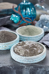 Fototapeta na wymiar Ancient nature minerals, different types of clay used for skincare, spa treatments, face masks, gray, black, green and blue mud, close up