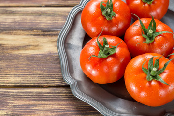 Tasty red ripe tomatoes gourmato from Belgium close up, ingredients for healthy salad close up copy space
