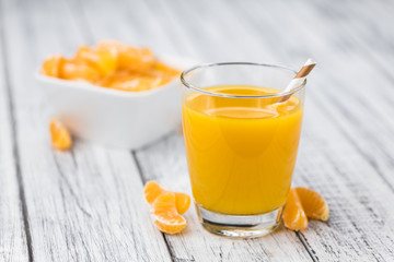 Fresh made Tangerine Juice (close-up shot)