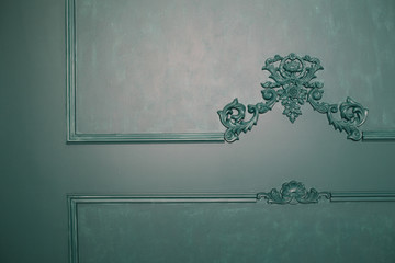 old colored wall with vintage moldings. architectural ornaments and elements for home decoration